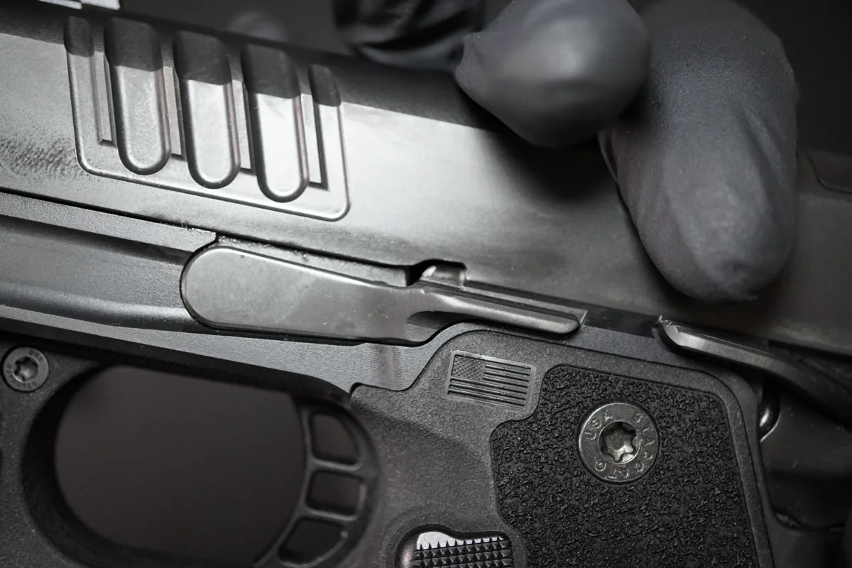 Staccato HD 3.6 with the slide racked back and locked open, showing the takedown window aligned with the slide stop