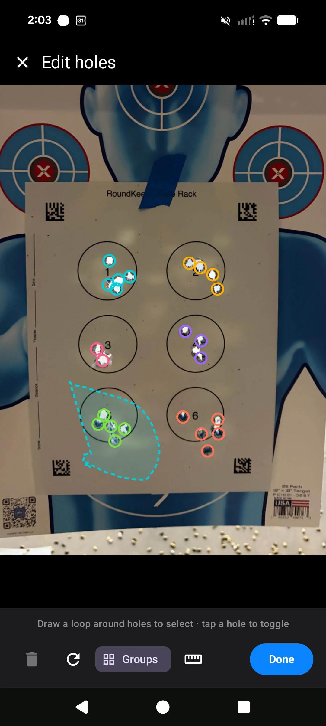 RoundKeep Zero — drawing a loop around a cluster of holes on a plate-rack target to assign them to a group